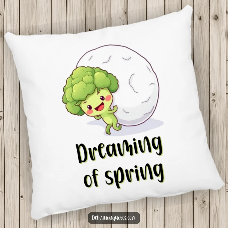 Funny pillow design of an optimistic broccoli floret character earnestly pushing a massive snowball uphill.