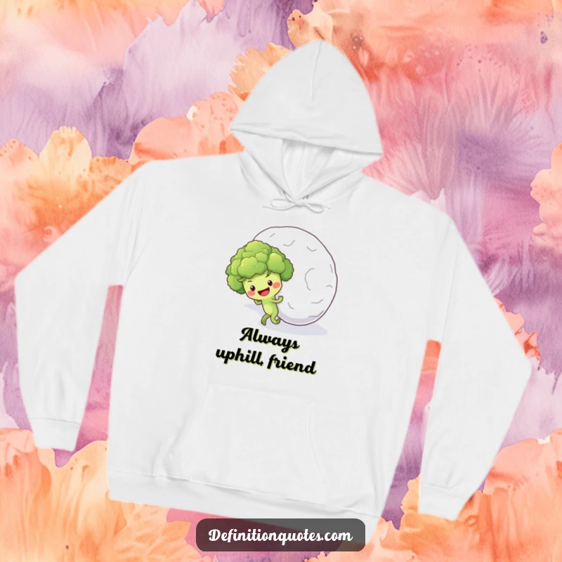 Funny hoodie featuring a determined broccoli floret character struggling to push a huge snowball up a snowy incline.