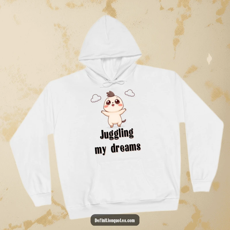 Funny Hoodie: A small, googly-eyed creature joyfully juggling three fluffy clouds, perfect for cozy days.
