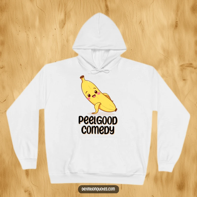 Funny banana character slipping on its peel, on a warm and cozy hoodie.