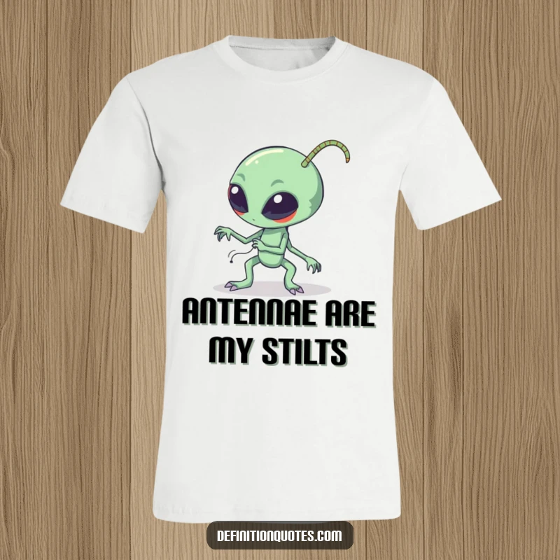 Funny clumsy alien tripping over its own long bendy antennae on a t-shirt, expressing extraterrestrial awkwardness and comical mishaps.